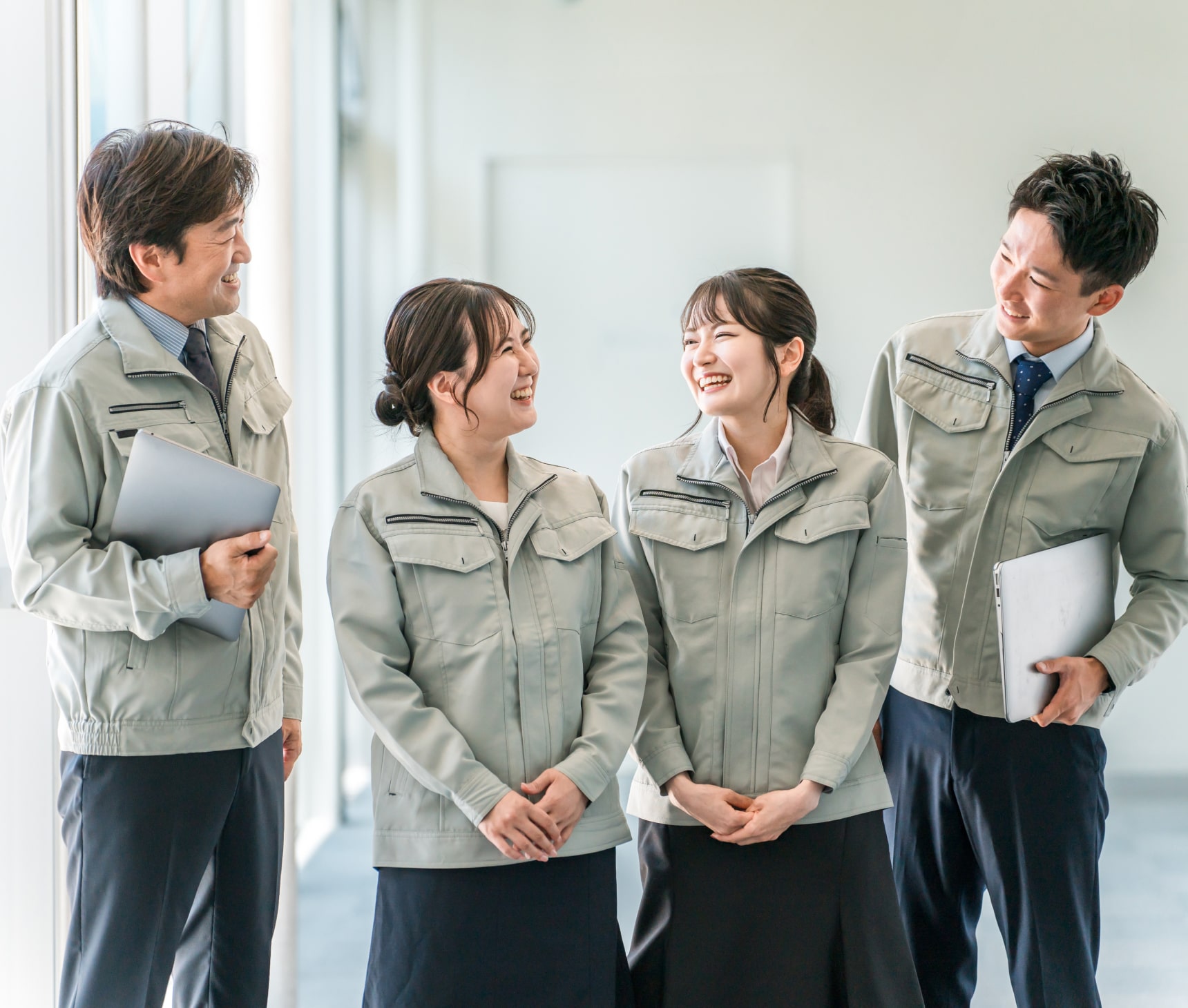 image of men and women talking at their working place for tablet