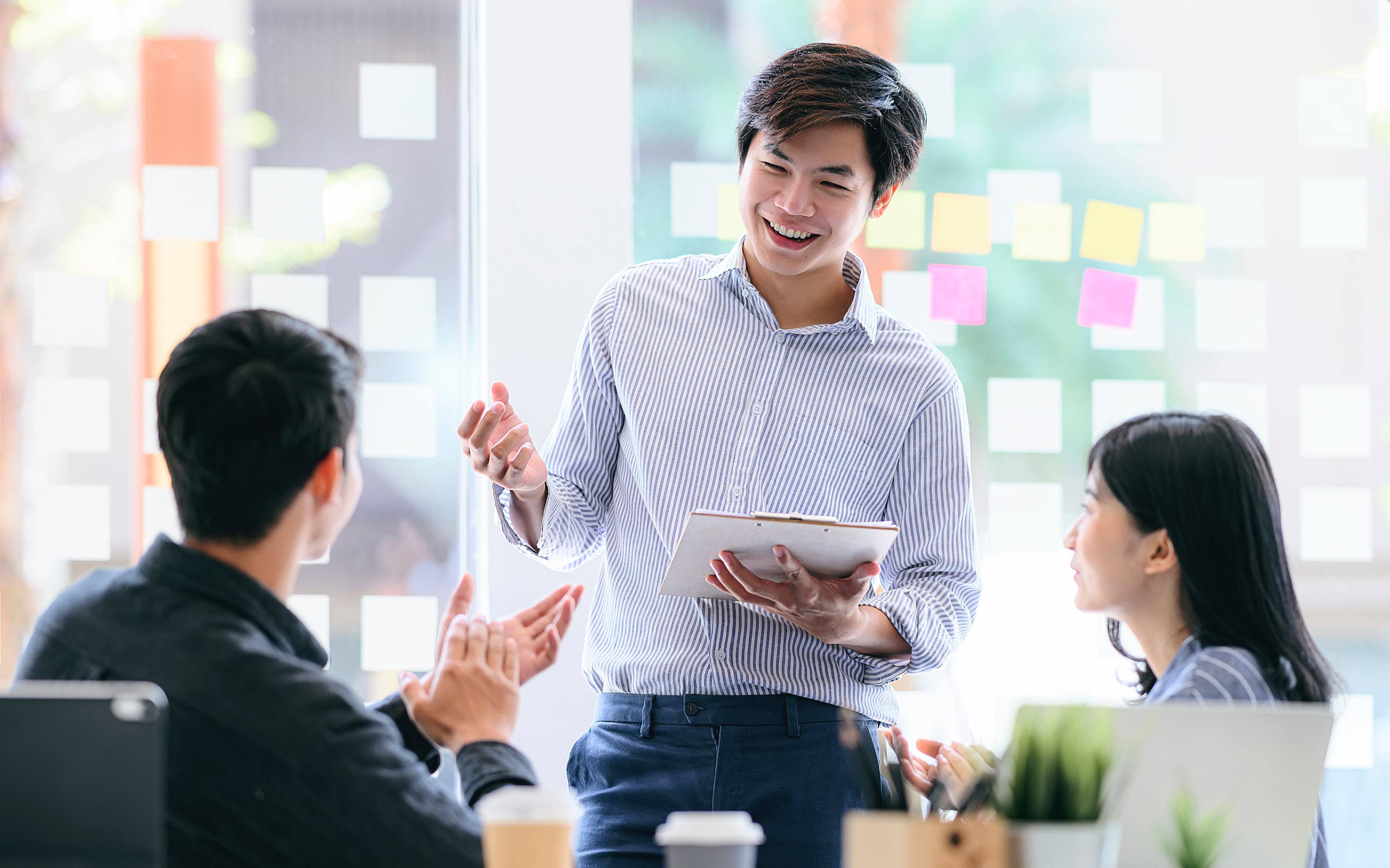 image of a man having a discussion with his colleagues