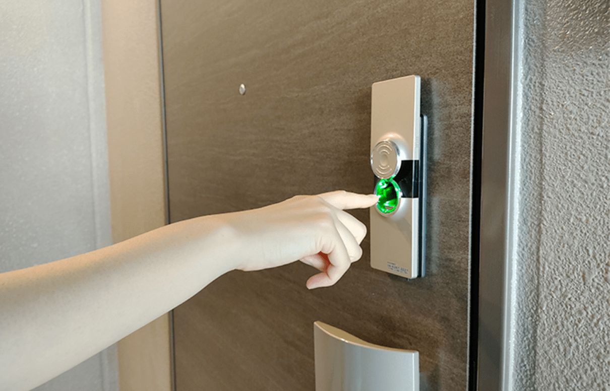image of AQUBIO implemented to a door with a finger approaching